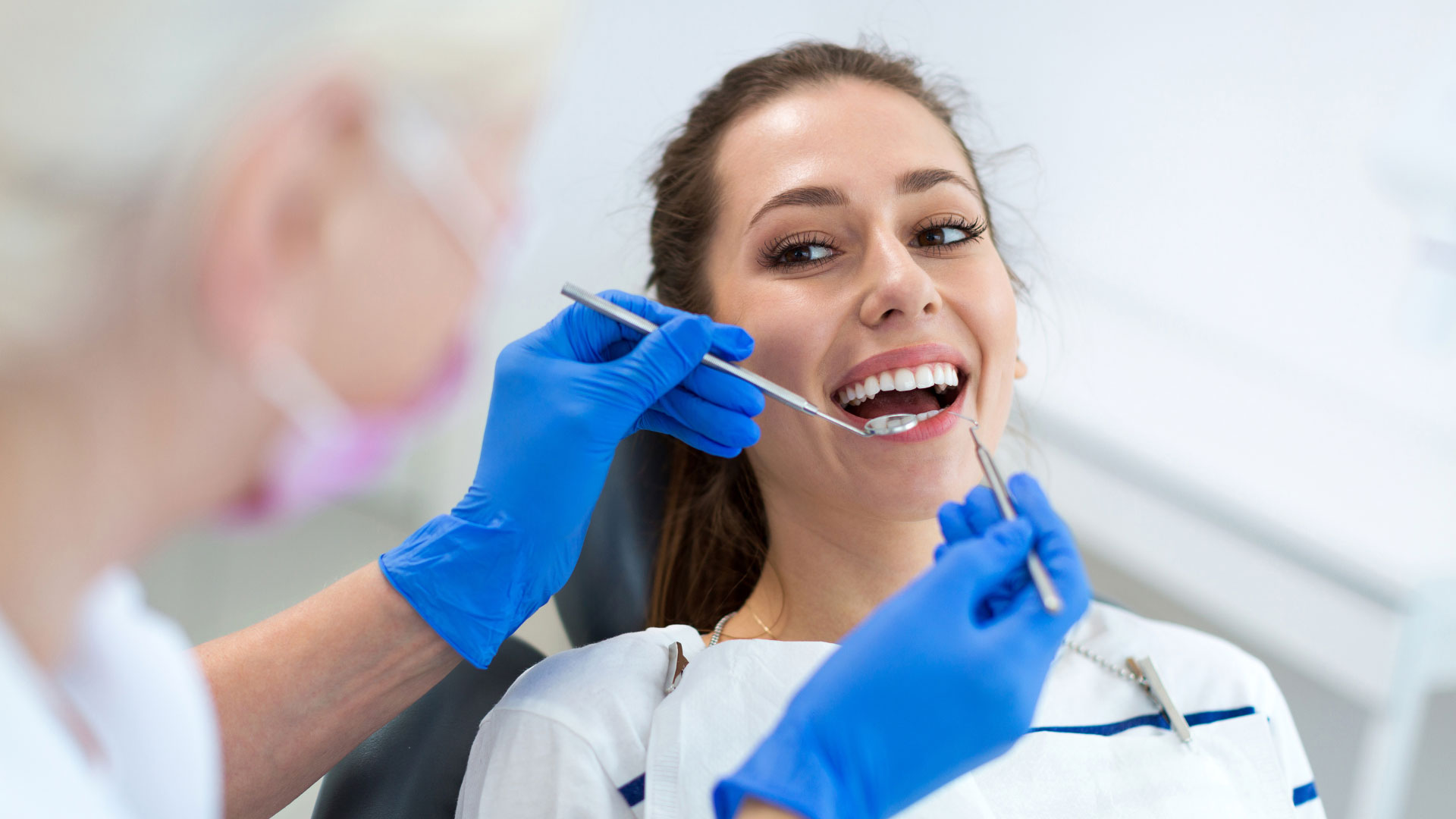 a patient trying to avoid dental implants or seeing a local veneer dentist with our preventative tips and appointments. preventive dental care to protect natural teeth.